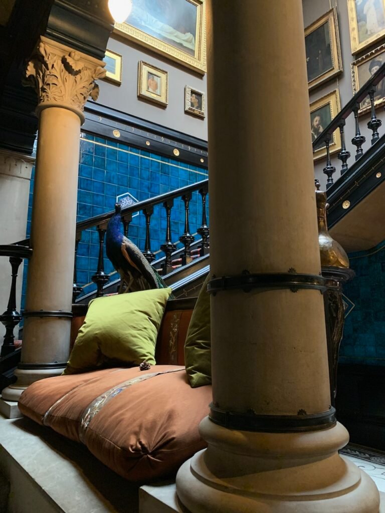 The Hall and Galleried Landing with its Stuffed Peacock